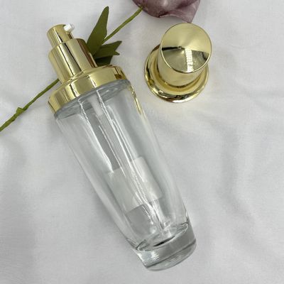 100ml διαφανές ωοειδές καλλυντικό χρυσό ΚΑΠ προσαρμοσμένο λοσιόν χρώμα μπουκαλιών